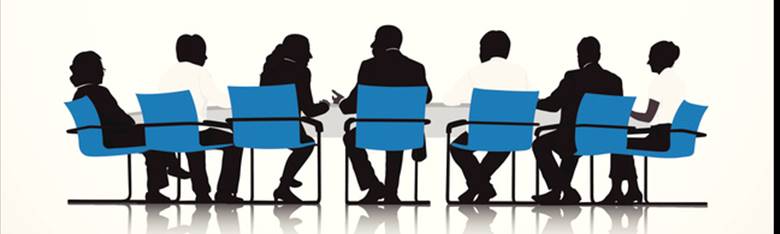 A group of people sitting in a meeting  Description automatically generated